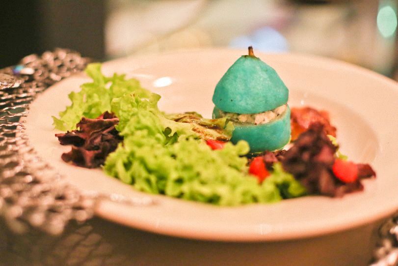 Foie gras with poached pear divided into 3 layers Roquefort, pear, and chestnuts! Served w pecan salad & strawberries (Photo by Macy Yap)