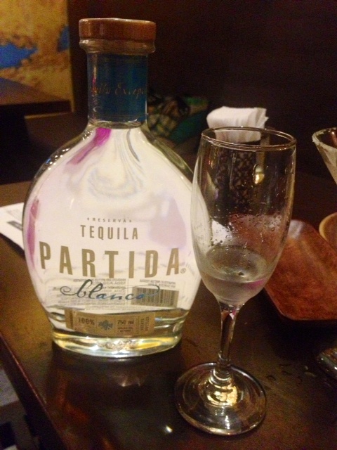 A shot of Partida Blanco (P450) is served in a long-stemmed glass. According to Aljor, this is how they drink tequila in Mexico