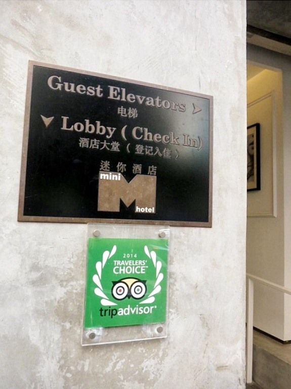 The hotel has been named TripAdvisor's 2014 Travelers' Choice. The lobby and check-in/ reception is at the basement to the left, while the guest elevators are to the right.