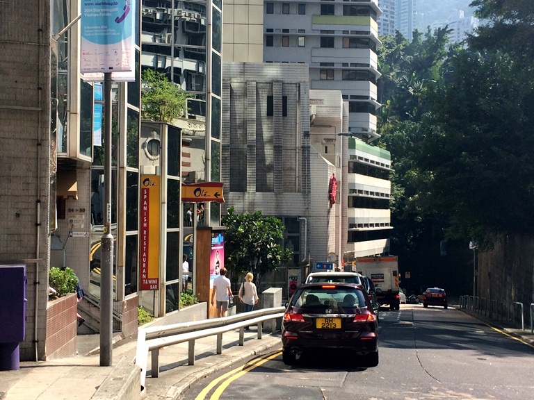 So you kinda get dropped off on this sloping street, so make sure to hope out fast as there are tons of cars that zoom by every minute.