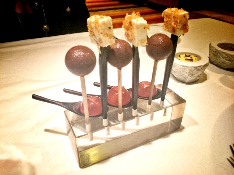 Amuse bouche to start: goat’s cheese topped with caramelized pork flakes; foie gras lollipops and limoncello jelly