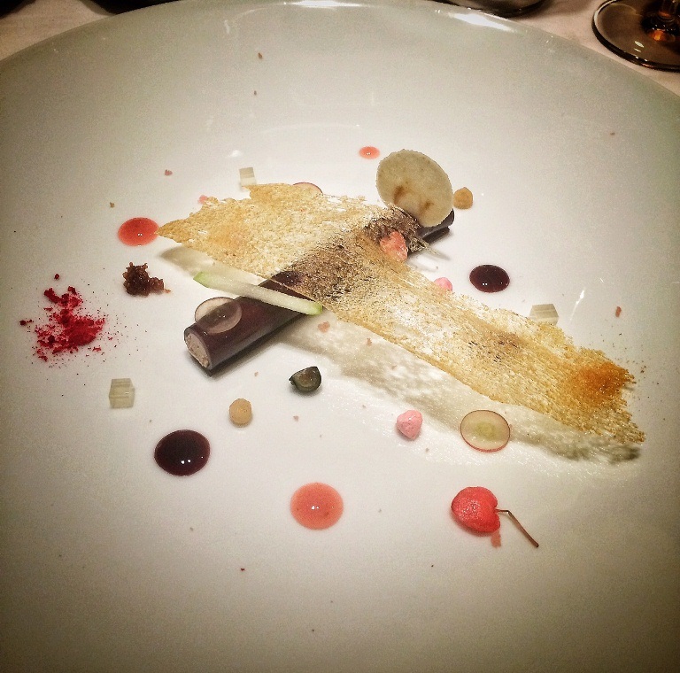 Duck liver terrine wrapped in spicy red wine jelly with cinnamon, port wine sauce, apple, strawberries (macarons, marshmallows, etc.) pear and honey