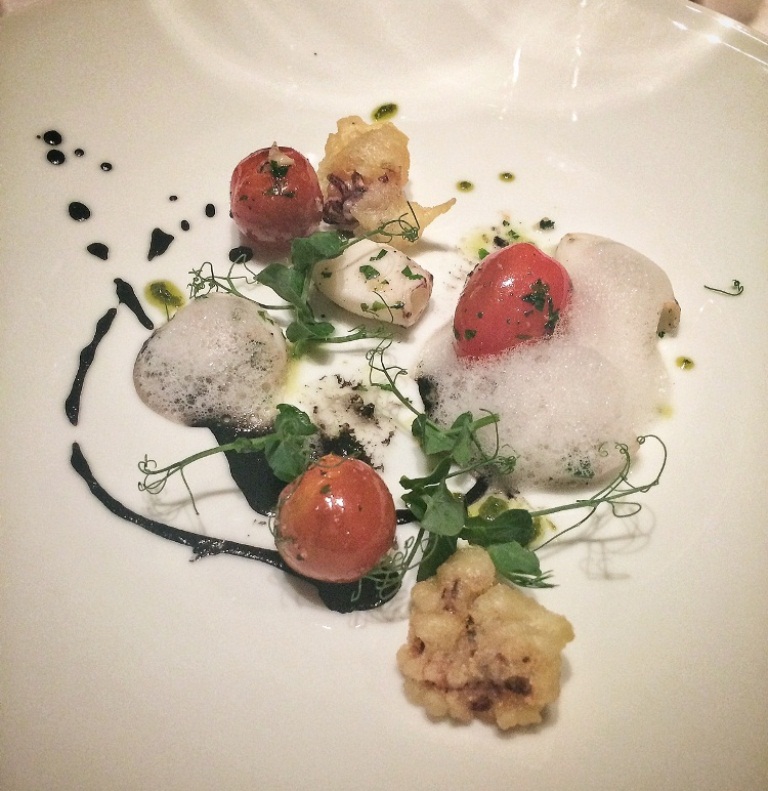 Pan fried baby calamari with cherry tomatoes, herbs, pesto and lemon