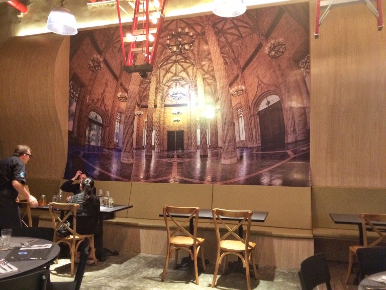 A mural of Valencia hangs as a backdrop at ArroZeria