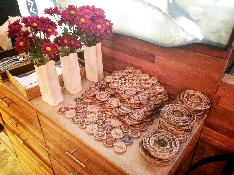 Recycled newspapers are used as coasters and paella holders in line with their thrust for sustainability