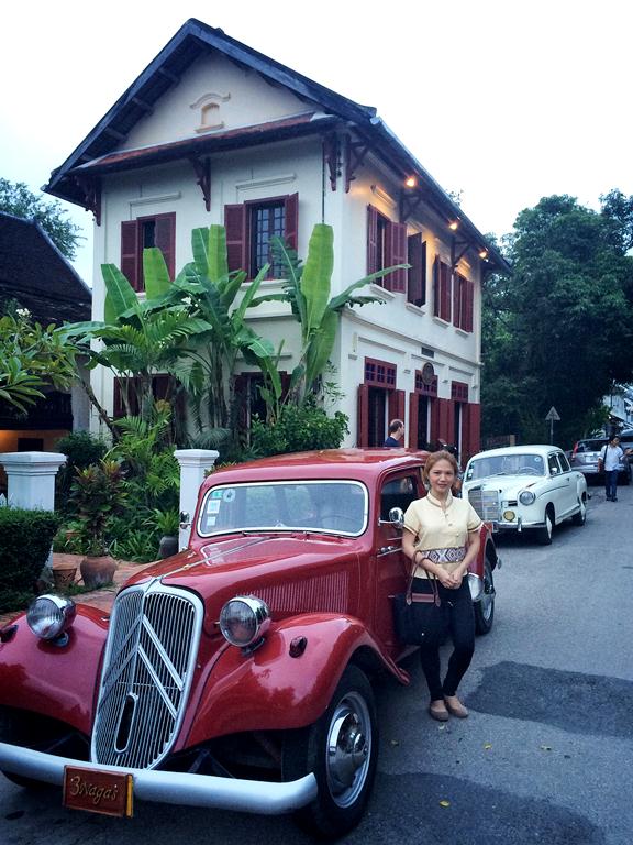 I bought a Laotian top so I could align with the colonial architecture of Luang Prabang-- with a stunning vintage car at that!