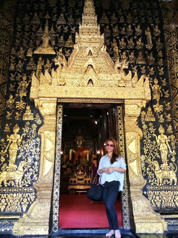 Me by the gorgeous ornate entrance of Wat Xieng Thong, which is also known as the Temple of the Golden City. You have to take off your shoes before entering.