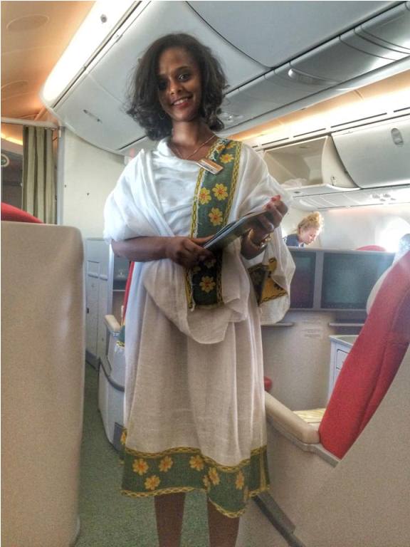 Our flight attendant was so kind and beautiful-- we couldn't stop staring at her and gushing-- this photo doesn't do justice!-- that I had to ask to take a photo of her. She is wearing a traditional Ethiopian dress.