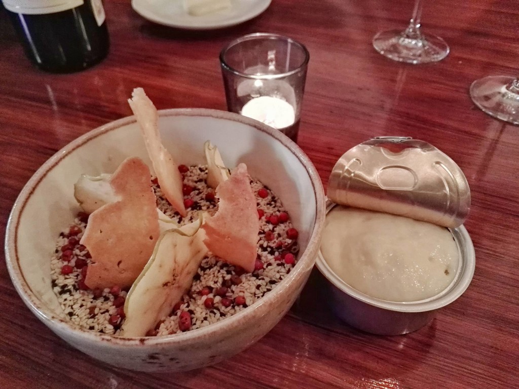 Amuse bouche of dehydrated fruits and toasted bread and aioli foam