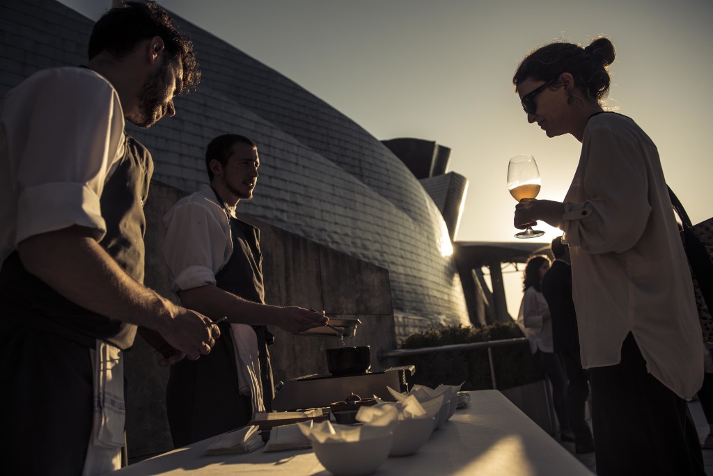 French journalist Camille Labro (Le Monde/ M Magazine World/ Vogue Paris) surveys the snacks served at the rooftop. (Photo by Miguel Toña - MTVisuals) 