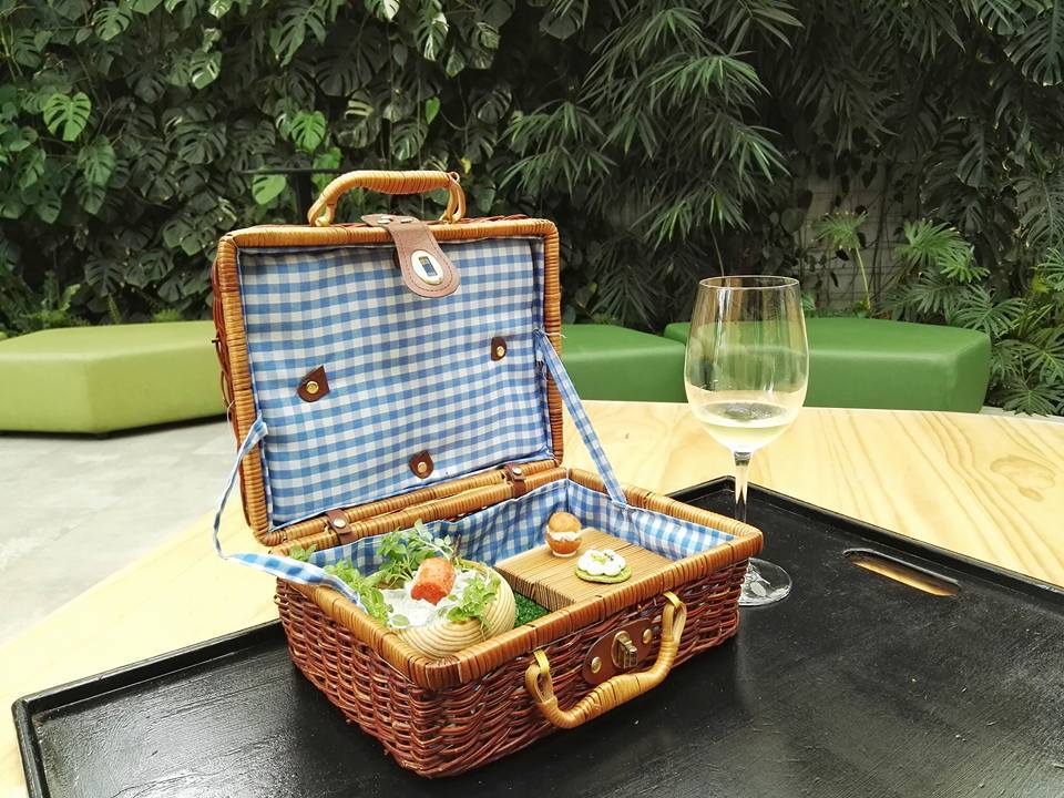 Welcome snacks at Azurmendi come in the form of their famous picnic basket and txakoli at their atrium (Photo by Cheryl Tiu)