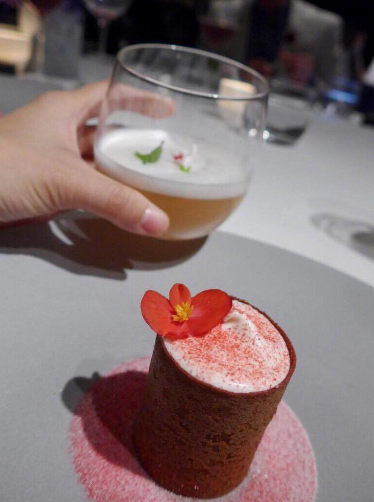 Dessert of raspberry, whipped cream with vanilla, roses, fresh cheese, and sour candy powder by Gert de Mangeleer paired with juice of rose and raspberry syrup (Photo by Cheryl Tiu)