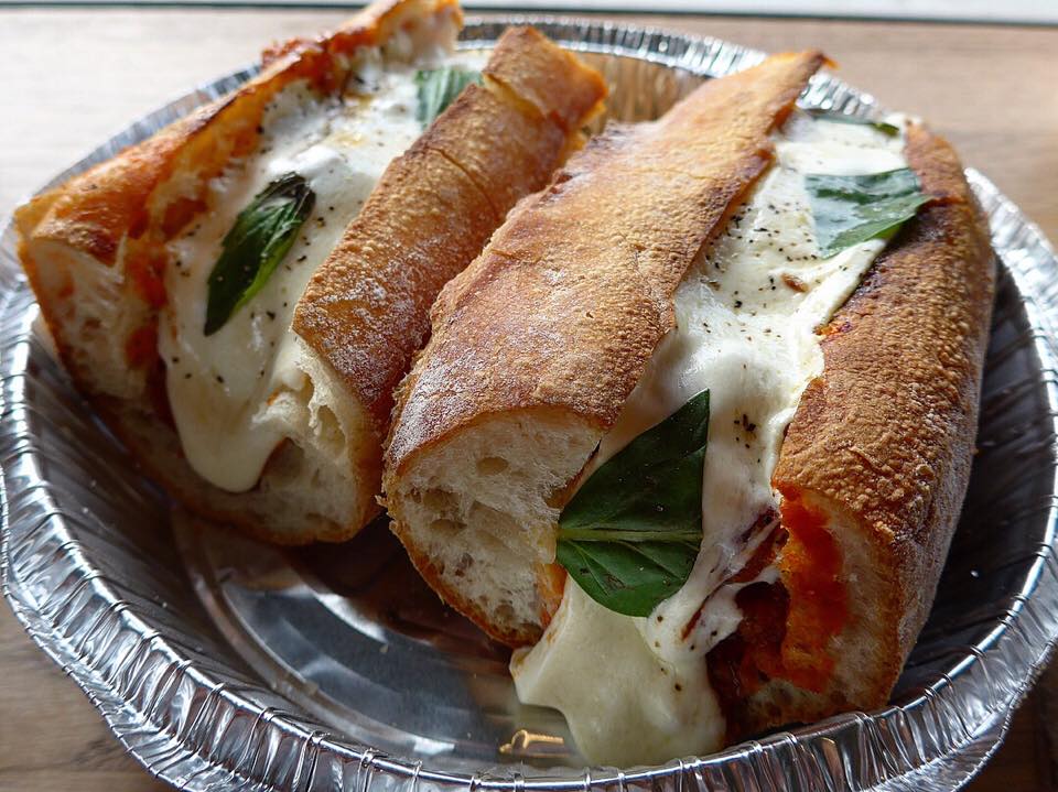 One more look at those glorious meatball sandwiches! Actually it's just one order, and they split it into two. (Photo by Cheryl Tiu)