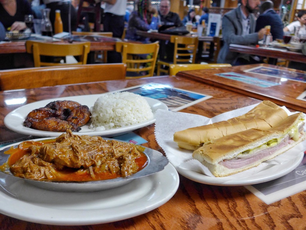 Puerto Sagua: Ropa Vieja (shredded stewed beef served with fried plantains and rice) and one of the best perfectly pressed Cuban sandwich -- I mean just look at all those layers! (Photo by Cheryl Tiu)