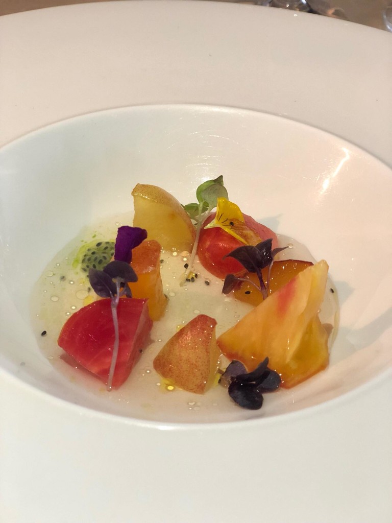 Cold Heirloom Tomato Consomme with Peach and Basil-- at first I was like peach and basil? But the flavors worked so sublimely, tinges of savory and sweet in a really light broth (Photo by Cheryl Tiu)