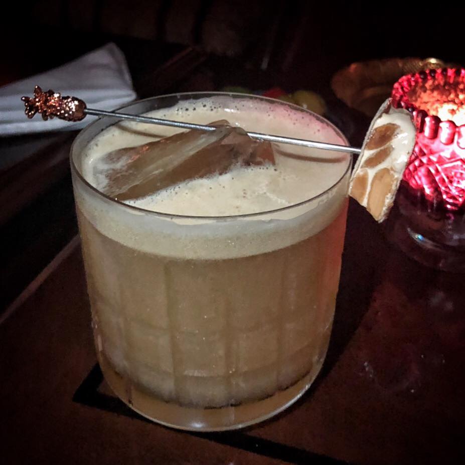 he Turron Sour, inspired by the nougat confection of the same name, with Woodford bourbon, roasted nuts, honey syrup and PX thick foam. (Photo by Cheryl Tiu)